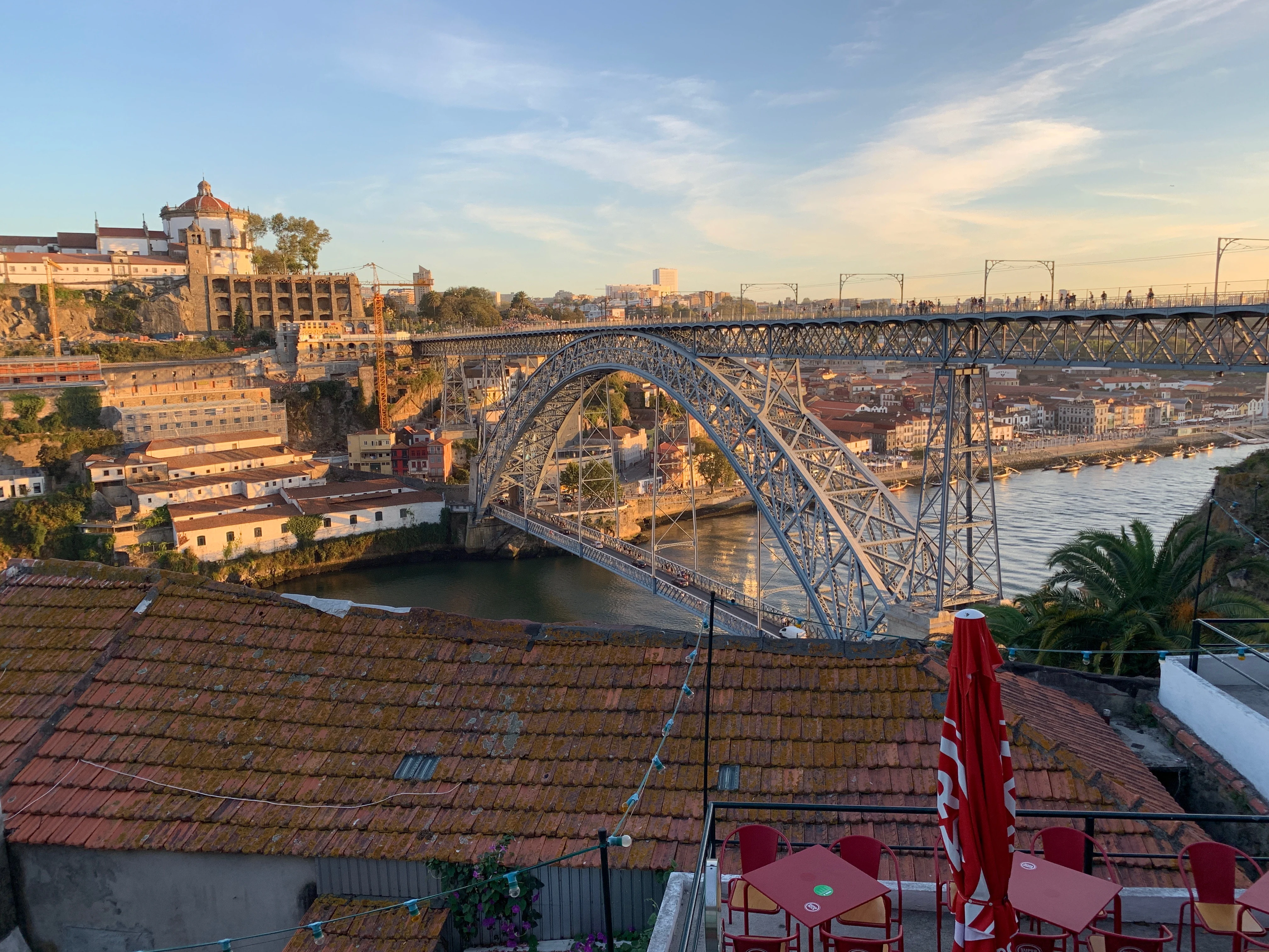 View of the bridge over the Douro river from Guindalense Futebol Club at sunset