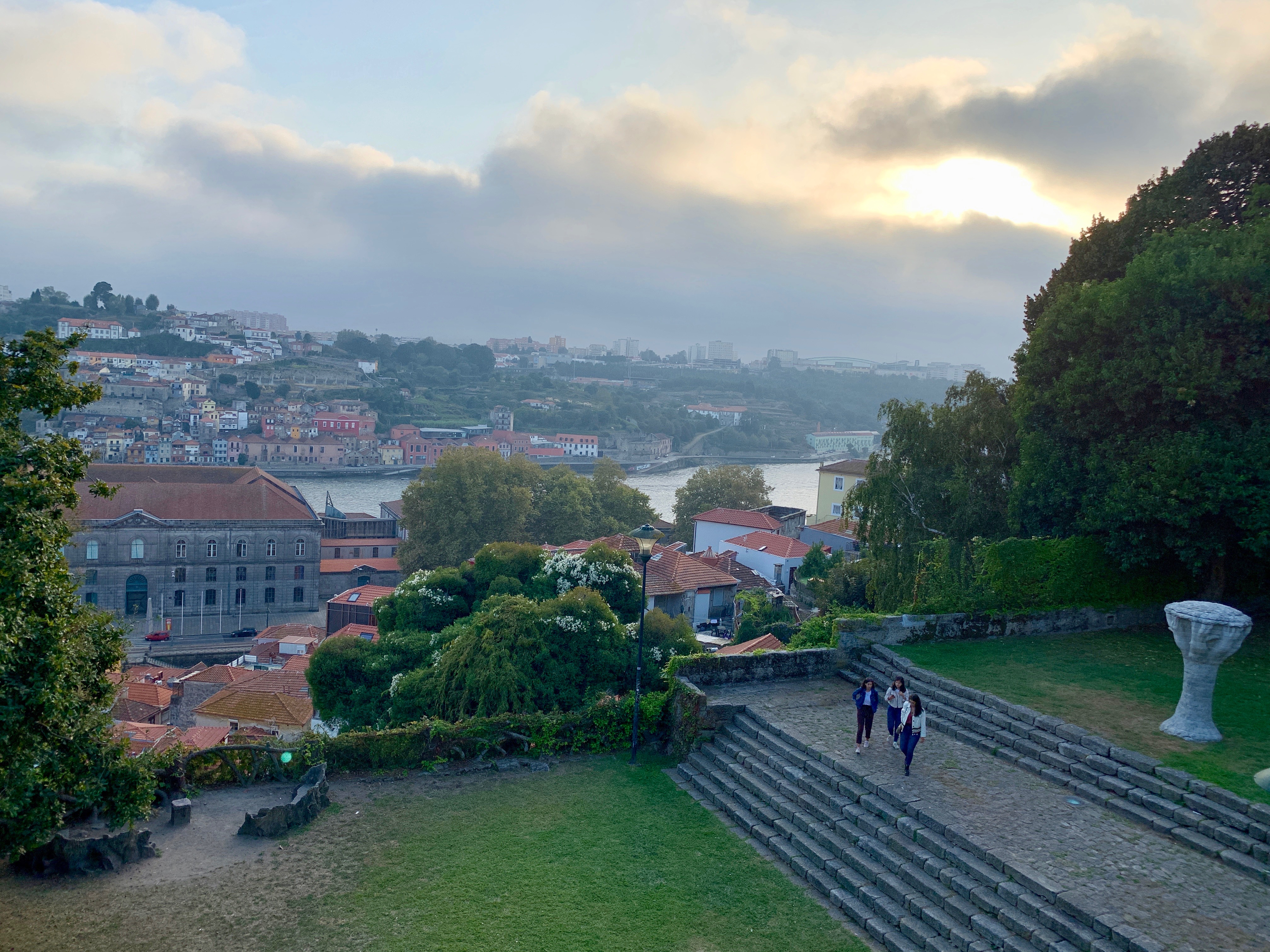 The grassy terraces of Parque das Virtudes overlooking the Douro river near sunset