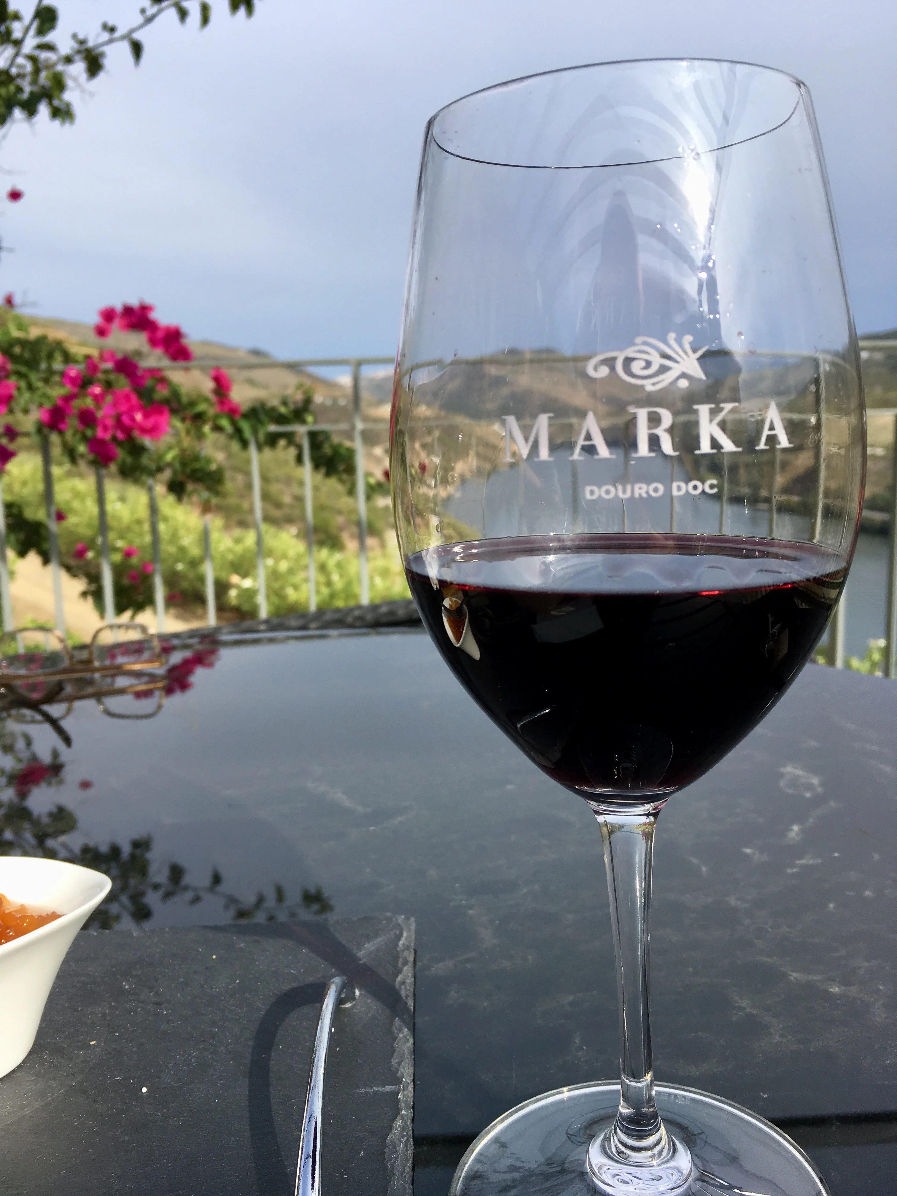 A glass of Duoro Red Wine in front of the Douro river
