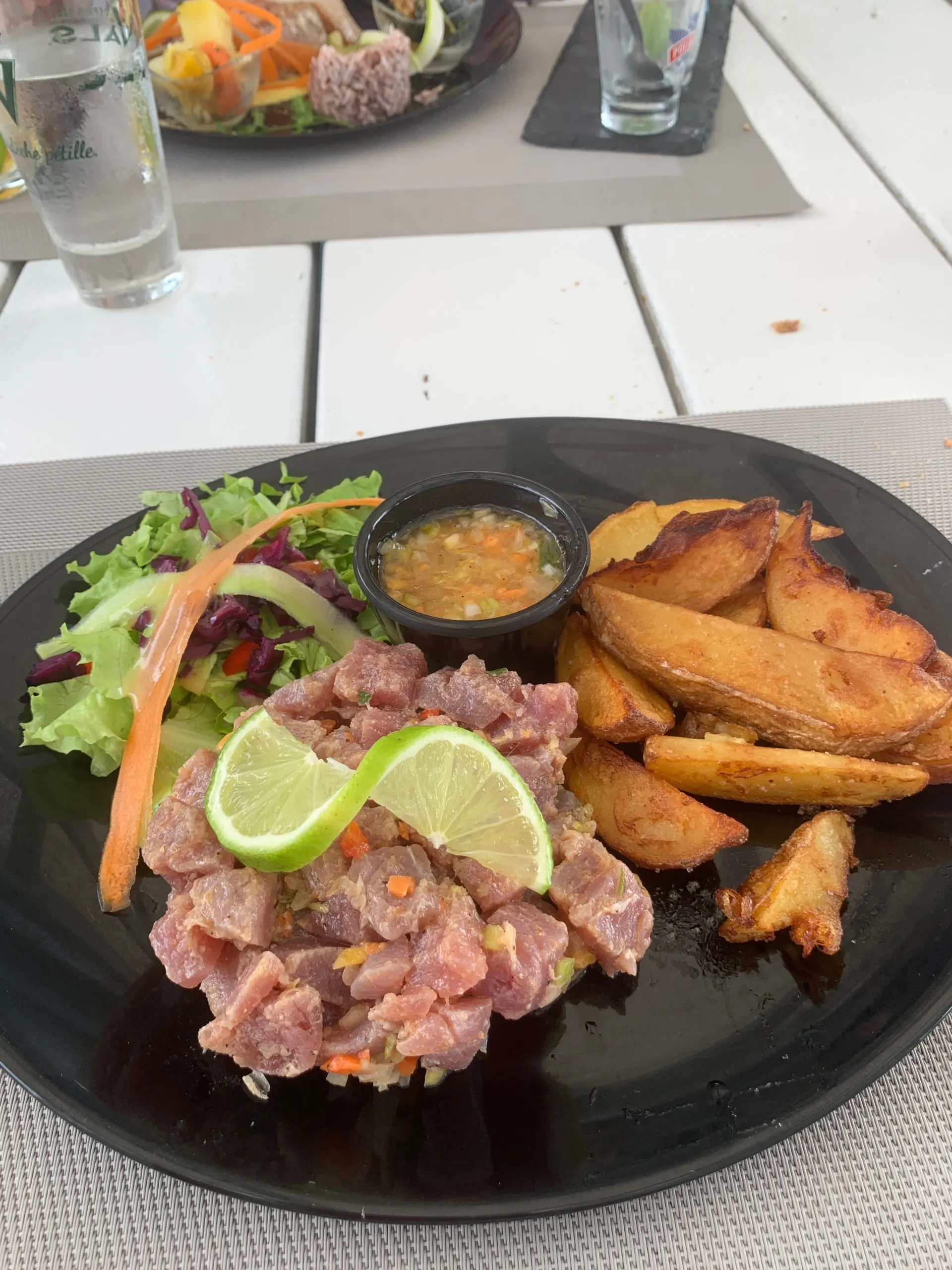 Marlin tartar with french fries and a small salad at Le Voile Blanche in Le Diamant