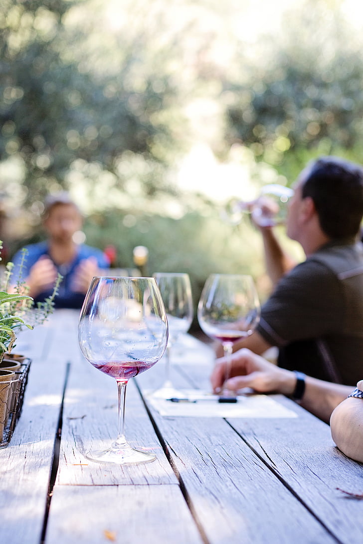 People drinking wine outdoors