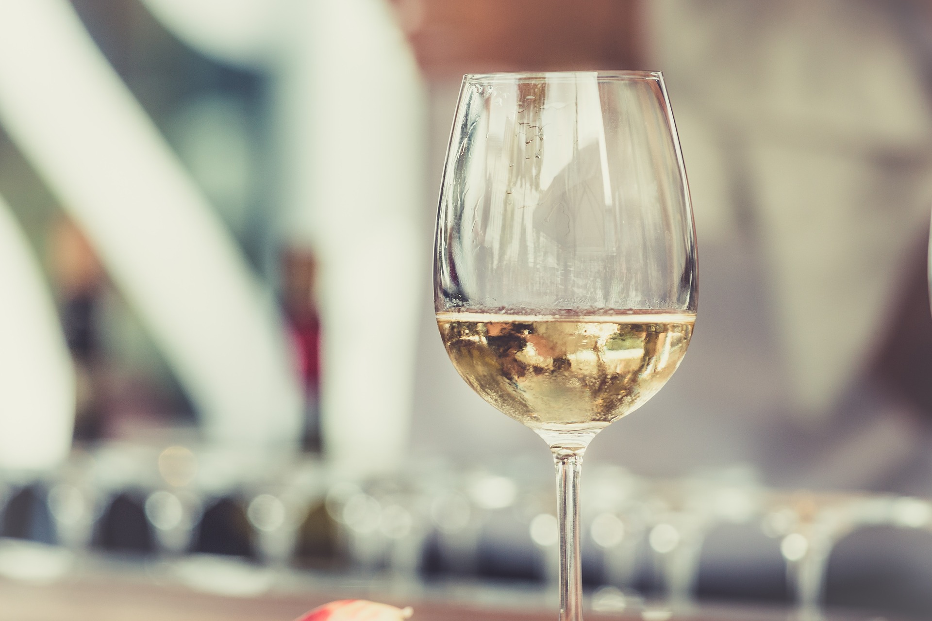 A glass of Sancerre Blanc on a bar.