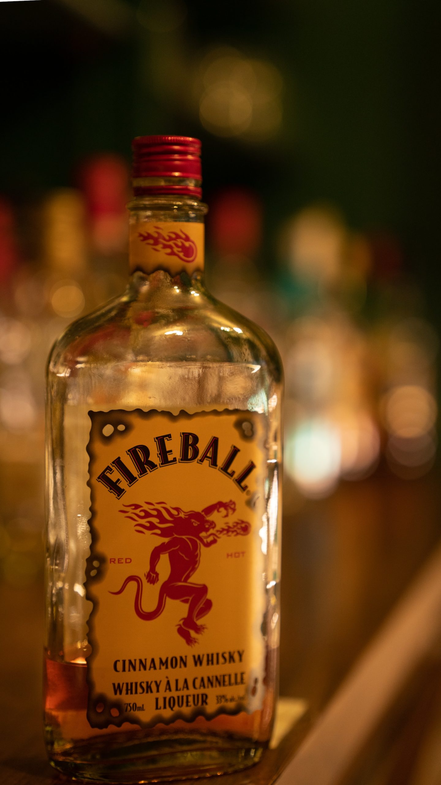 A bottle of Fireball Cinnamon Whiskey on a bar