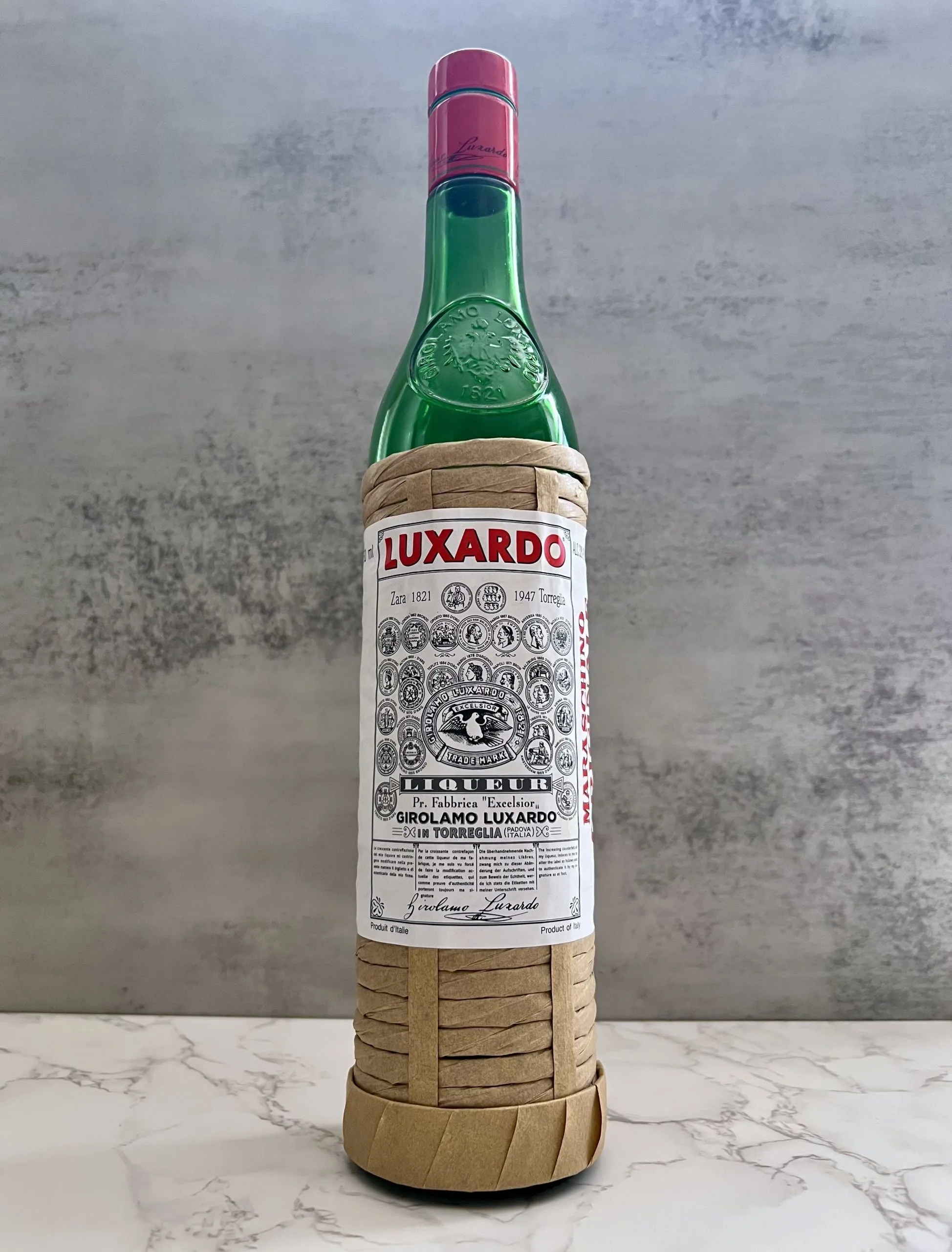 A bottle of Luxardo Maraschino Originale on a counter top. 